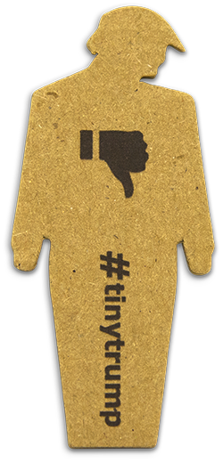 three inch high cardboard cutout of a trump figure with its head down, thumbs down stamped on its chest, and #tinytrump written vertically on the legs