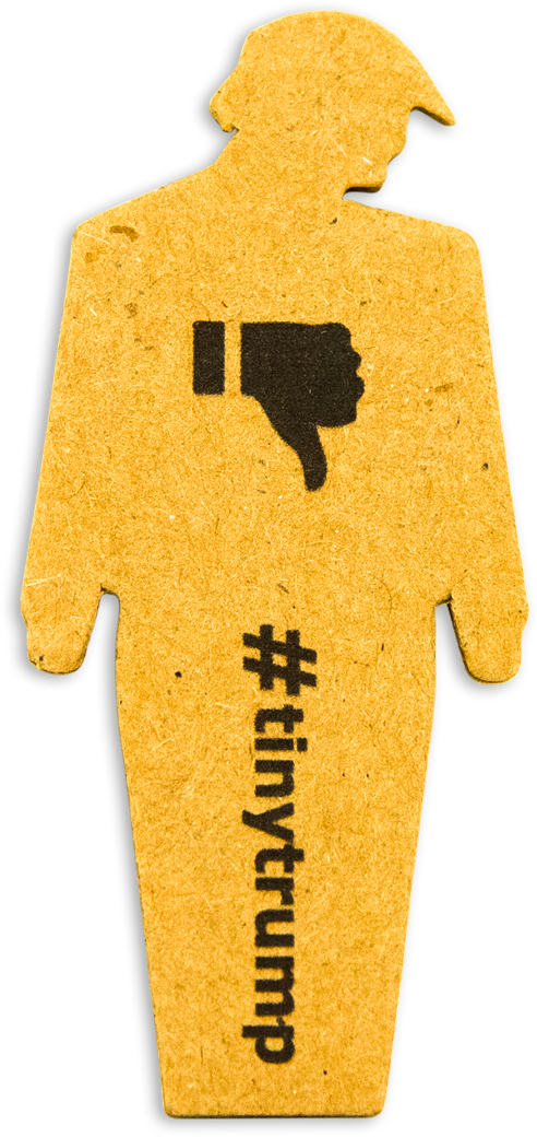 three inch high cardboard cutout of a trump figure with its head down, thumbs down stamped on its chest, and #tinytrump written vertically on the legs