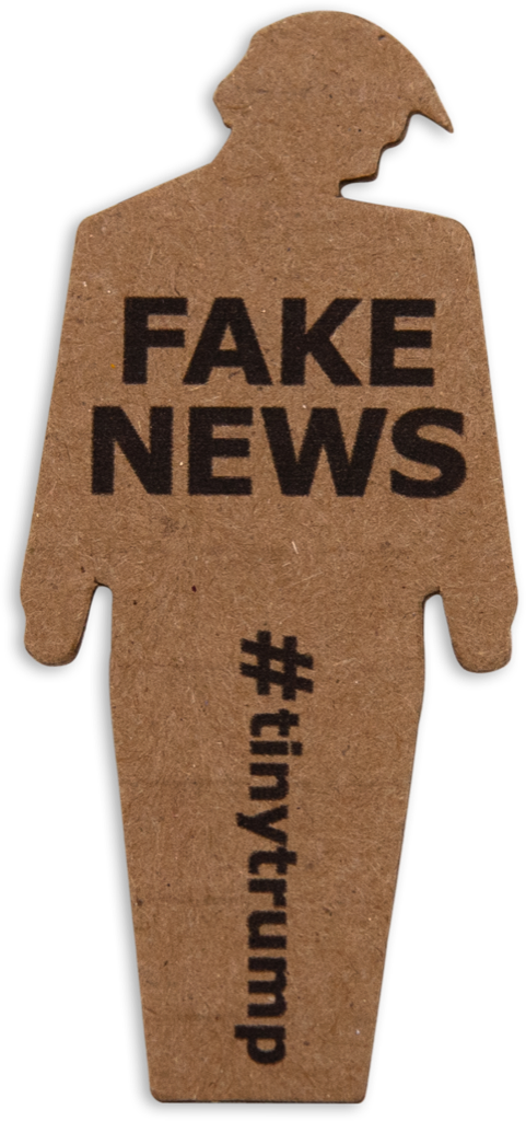tiny trump with the slogan 'Fake News'