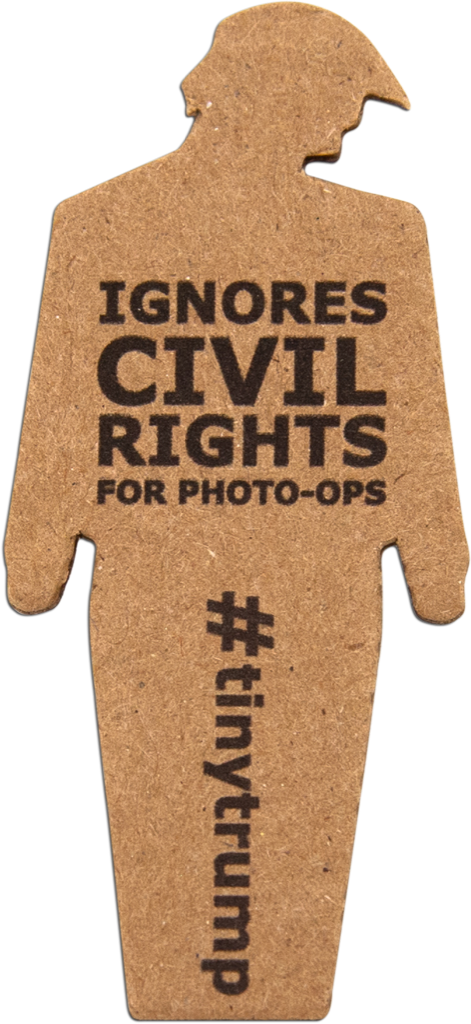 tiny trump with the slogan 'Ignores Civil Rights for Photo-Ops'